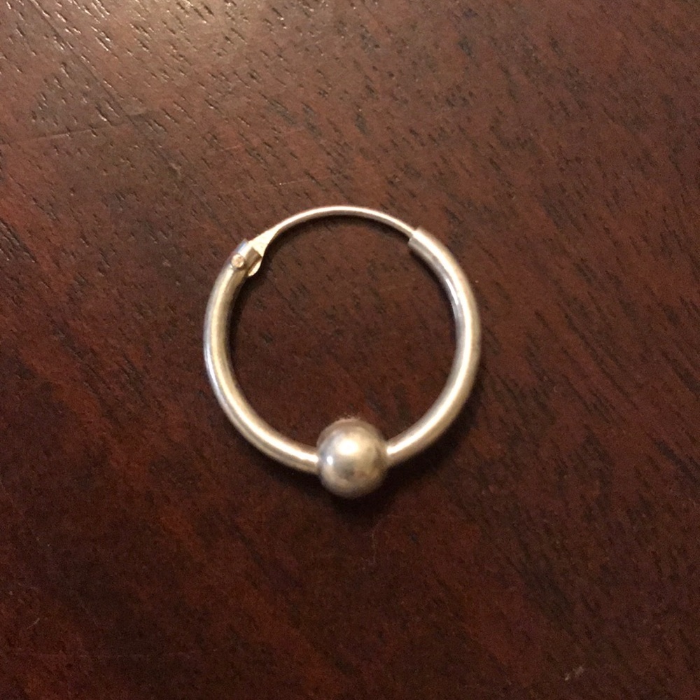One sterling silver hoop earring with ball